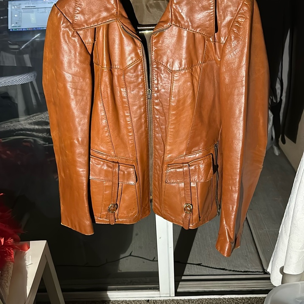 Men’s small  brown Leather long Jacket with 2 pockets on each side. Zips up